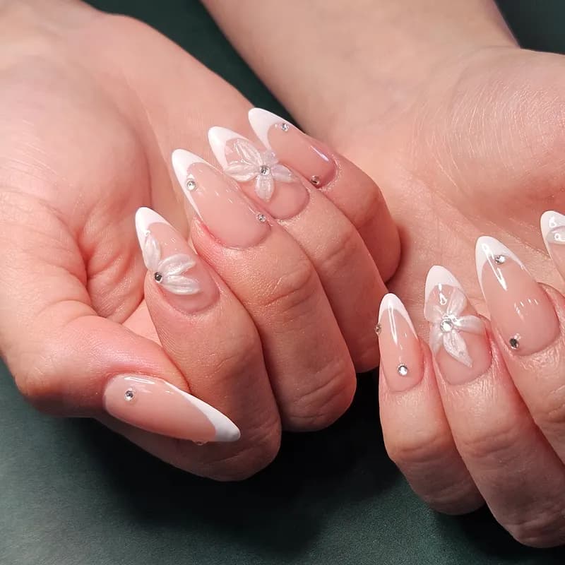 Solar nails, 3D, Y2K, gems, French by Nails Unlimited in Sugar Land, TX